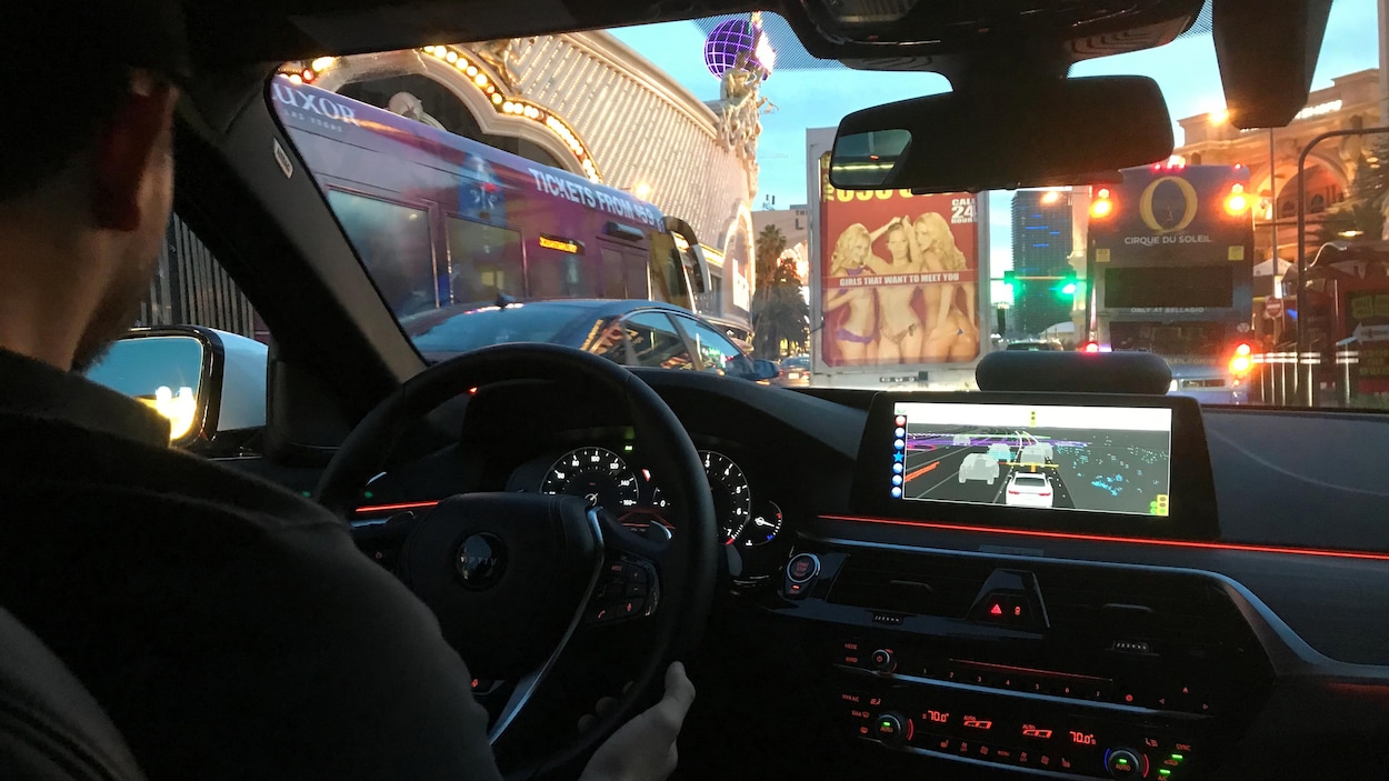 Un conducteur fait la démonstration d'un véhicule autonome de l'entreprise Aptiv durant le CES, à Las Vegas. Un conducteur fait la démonstration d'un véhicule autonome de l'entreprise Aptiv durant le CES, à Las Vegas.