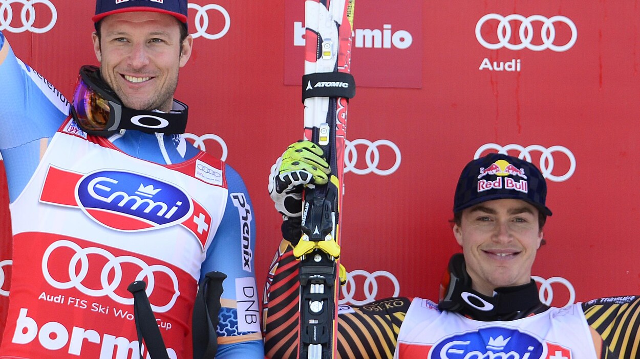 Aksel Lund Svindal et Erik Guay sur le podium de la course de Bormio en 2013.