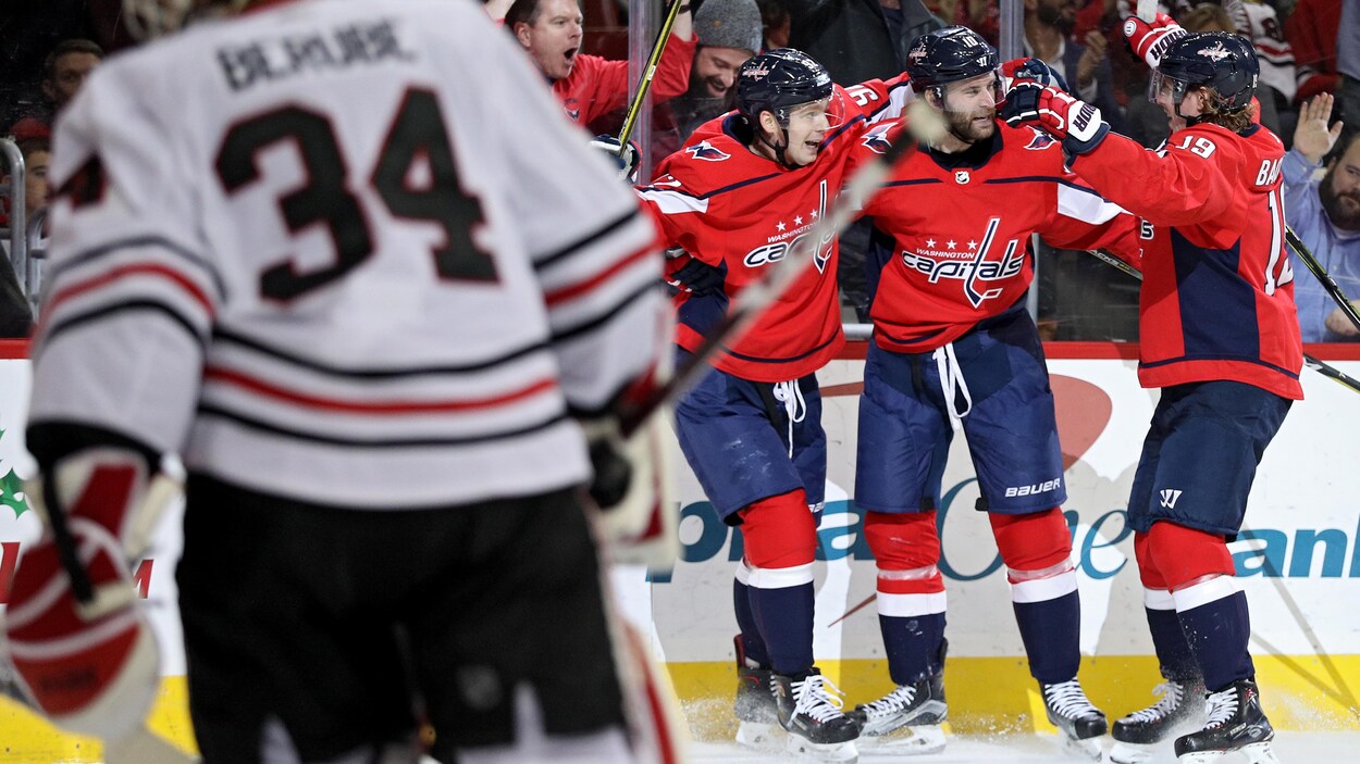 Les Capitals de Washington célèbrent un but. Les Capitals de Washington célèbrent un but.