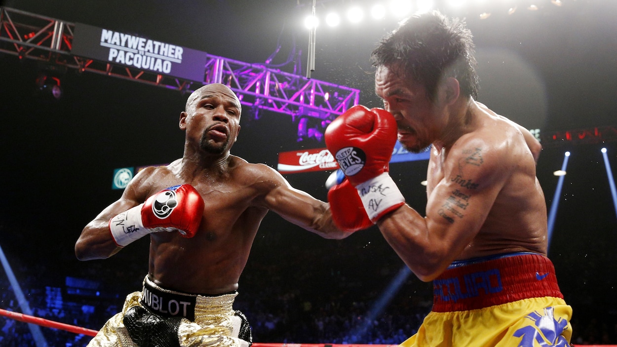 Le combat entre Floyd Mayweather et Manny Pacquiao en mai 2015 est le plus rémunérateur de l'histoire de la boxe. Le combat entre Floyd Mayweather et Manny Pacquiao en mai 2015 est le plus rémunérateur de l'histoire de la boxe.