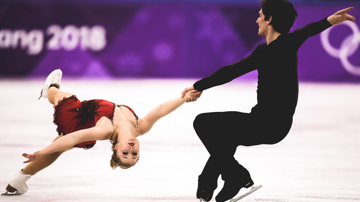 Charlie Bilodeau fait tourner Julianne Séguin pendant leur programme libre. Charlie Bilodeau fait tourner Julianne Séguin pendant leur programme libre.