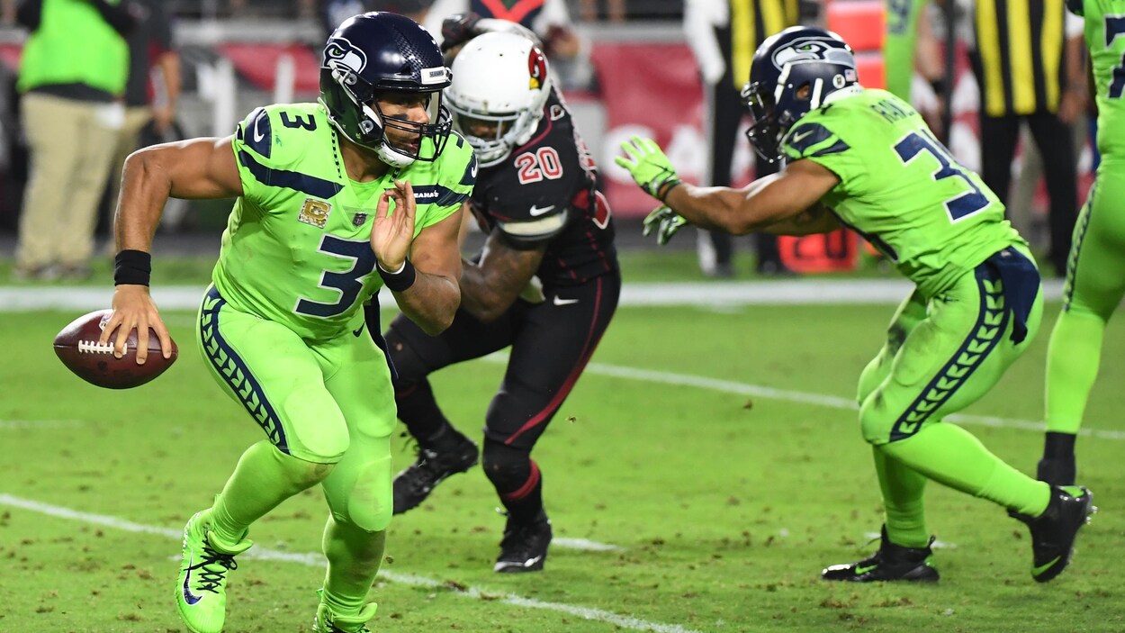 Russell Wilson (gauche) Russell Wilson (gauche)