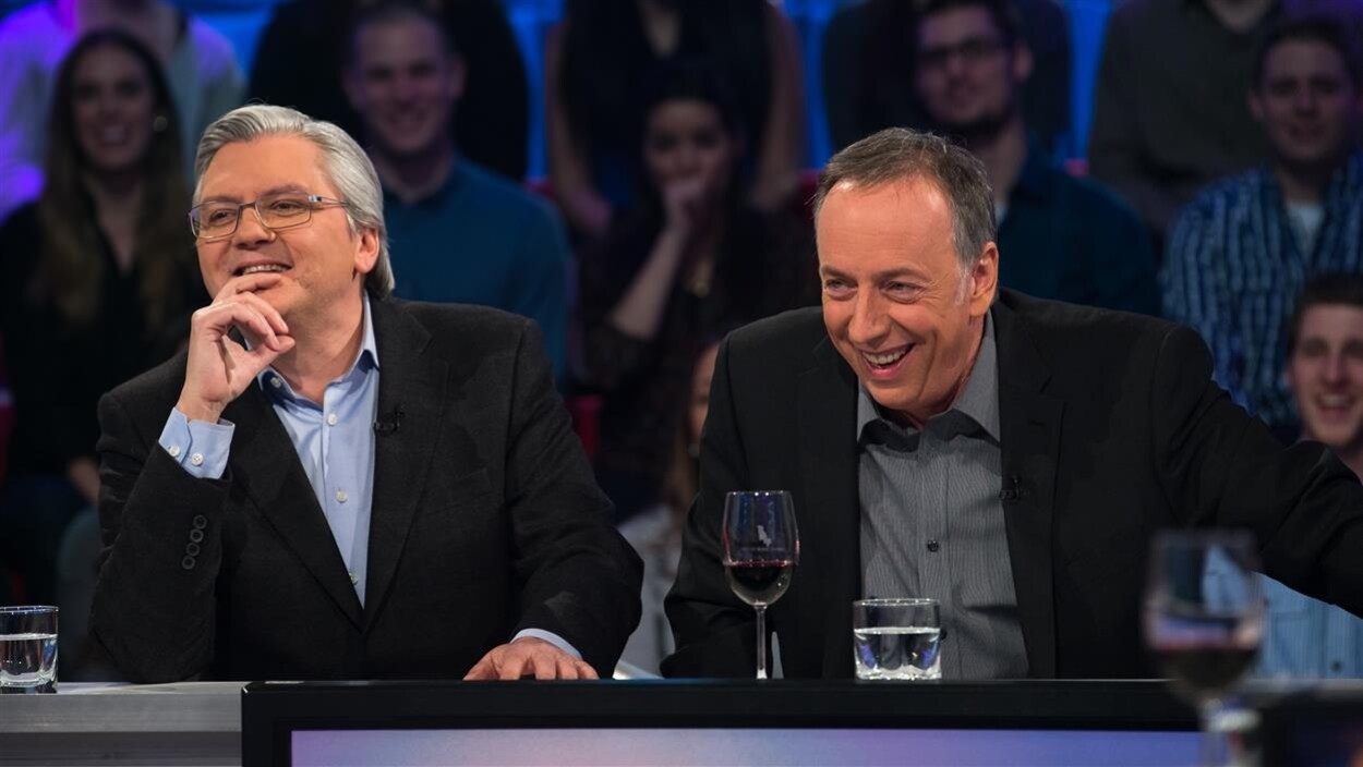 Richard Martineau et Benoit Dutrizac rient.