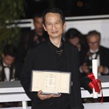 Director Tran Anh Hung, winner of the award for best director for 'The Pot-au-feu,' poses for photographers during a photo call following the awards ceremony at the 76th international film festival, Cannes, southern France, Saturday, May 27, 2023. (Photo by Vianney Le Caer/Invision/AP)