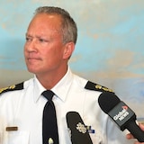 Edmonton Police Service interim Chief Devin Laforce speaks to media after a police commission meeting on July 17, 2025.