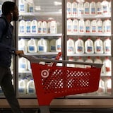 A shopper walks past the milk and dairy display case at a Target store in Manhattan. Canadian Food Inspection Agency laboratories have tested 142 retail milk samples from across Canada to spot any traces of bird flu, amid an outbreak of H5N1 in the U.S., officials say. 