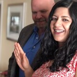 Neha Singh of Sudbury, Ont takes the official Canadian citizenship oath during a ceremony on Zoom on Monday, while her husband Jake Tapper looks on. (Angela Gemmill/CBC)