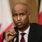 Housing and Diversity and Inclusion Minister Ahmed Hussen speaks during a news conference in Ottawa on Feb. 15. Hussen announced Monday that the government would ease some restrictions on foreign ownership of residential property. 