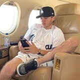 Aiden Pleterski, 23, dubbed 'the Crypto King' in several paid-for promotional articles, which included this photo of him on a private jet, owned nearly a dozen high-end vehicles and was paying $45,000 a month to rent a lakefront mansion in Burlington, Ont. (TechTimes)