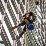 A window washer is pictured in Vancouver on May 13. Canada's economy added 27,000 jobs in May, while unemployment inched up slightly to 6.2 per cent, according to Statistics Canada. 