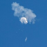 Picture  from the ground captured the moment a U.S. military fighter aircraft shot down a suspected Chinese spy balloon as it floated off the coast of South Carolina.