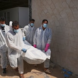 Bodies of unidentified Palestinians returned from Israel as part of the ceasefire deal are brought to Nasser Hospital in Khan Younis, Gaza Strip, Friday.