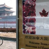 A Chinese man cycles past a billboard in front of Beijing's Forbidden City before a 2001 visit by then-Canadian prime minister Jean Chretien. At the time, concerned U.S. officials were secretly probing Chinese operations in Canada. (Reuters)