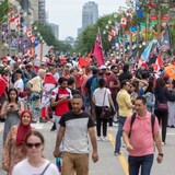 People gather on Wellington street in front of Parliament Hill during Canada Day in Ottawa on Friday July 1, 2022. 
