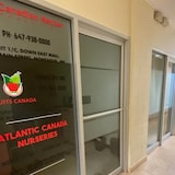 The Canadian Nectar Products office at the Down East Mall in Montague was closed and dark at 10:45 a.m. on a Wednesday morning this past August. Company information for Fruits Canada and Atlantic Canada Nurseries was also listed on the office door. (Carolyn Ryan/CBC)