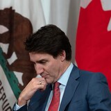 Prime Minister Justin Trudeau listens as California Governor Gavin Newsom delivers remarks at the start of a meeting in San Francisco on Nov. 15, 2023. (Adrian Wyld/Canadian Press)