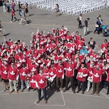 Former Ottawa Senators NHL player Daniel Alfredsson poses with new Canadian citizens wearing Team Canada hockey jersey's at a citizenship ceremony for the World Cup of Hockey 2016 Legacy Project in Toronto on Tuesday September 20, 2016. THE CANADIAN PRESS/Mark Blinch
