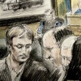Nathaniel Veltman, left, and his lawyers watch on a monitor as a video of his arrest is played to the jury at his murder-terror trial while Crown prosecutor Jennifer Moser stands in the foreground. The accused is charged in the truck attack on the Afzaal family in London in June 2021. The trial in Ontario Superior Court in Windsor entered its third week of proceedings on Monday. (Pam Davies/CBC)