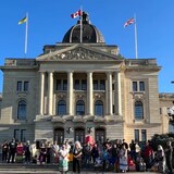 Supporters for Dawn Walker gather at the legislature in Regina on Tuesday to issue calls for Walker to be extradited back to Canada from the U.S. (Adam Bent/CBC)