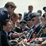From left to right, France's Prime Minister Gabriel Attal, Canadian Prime Minister Justin Trudeau and Britain's Prince William, the Prince of Wales, speak with veterans following speeches at the Canadian commemorative ceremony marking the 80th anniversary of Allied D-Day landings in Normandy. (Lou Benoist/Reuters)