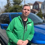 Derek Crocker stands in front of a replacement truck, after the one he bought at a Toronto dealership was identified as stolen. 