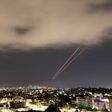 Objects are intercepted in the sky after Iran launched drones and missiles toward Israel, as seen from Ashkelon, Israel April 14, 2024. 