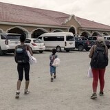 A Venezuelan family near the El Cinchado crossing at the Honduras-Guatemala border last month. The daughter, grandson and grandmother reached the facility after a dangerous trip through South and Central America. (Nicolò Filippo Rosso/UNHCR)