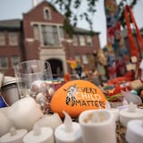 A rock with the message 'Every Child Matters' painted on it sits at a memorial outside the former Kamloops residential school, in Kamloops, B.C., on July 15, 2021. 