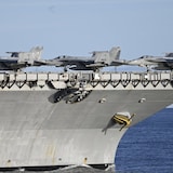 F-18 fighter jets are shown on the deck of the the world's largest aircraft carrier, the USS Gerald R Ford, during the NATO Neptune Strike 2025 exercise in the North Sea on Sept. 24. The Ford is being deployed to waters near South America. 