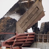 A heavy hauler mining truck dumps a load of bitumen ore at the Fort Hills oilsands facility, near Fort McMurray, Alta. 