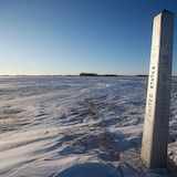 A border marker near Emerson, Man., where four people — including a baby and a teen — died in 2022 trying to cross into the United States. Advocates for refugees fear efforts to cut down on crossings away from border stations will only make lives more dangerous for people fleeing persecution. 