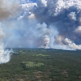 The Parker Lake wildfire burns near Fort Nelson, B.C. on Monday, May 13, 2024. A federal government panel's report lists extreme weather-driven events like wildfires as one of the key near-term threats to Canada and the world.