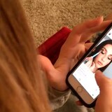 A woman looks at Instagram. As kids and teens scroll on social media, their behaviour may change in both the short- and long-term. (Haven Daley/The Associated Press)