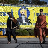 Members of the Sikh community are pictured at the Guru Nanak Sikh Gurdwara, where Hardeep Singh Nijjar was murdered June 18, in Surrey, B.C. (Ben Nelms/CBC)