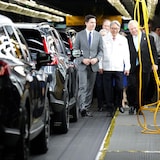 Prime Minister Justin Trudeau, left, Honda CEO Toshihiro Mibe, centre, and Ontario Premier Doug Ford, right, visit Honda's automotive assembly plant in Alliston, Ont., as the company announces plans to build electric vehicles and their parts in Ontario with financial support from the federal and provincial governments, on April 25, 2024.