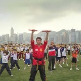 Martial arts experts lead children in an official ceremony in Hong Kong harbour in April to celebrate Beijing’s imposition of a national security law in the territory. (Saša Petricic/CBC)