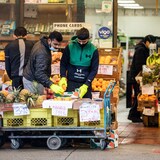 Shoppers are pictured buying groceries in Vancouver earlier this year.