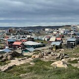 A skyline of the city of Iqaluit on a sunny day in summer.