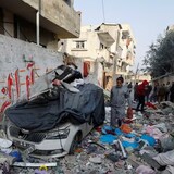 Palestinians inspect the site of an Israeli strike on a house, in Rafah in the southern Gaza Strip on Feb. 27. The death toll in Gaza since Oct. 7 passed another grim milestone, Palestinian health officials said Thursday. 