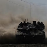 An Israeli tank moves near the Gaza Strip border in southern Israel on March 13, 2024. 