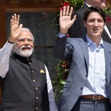 Prime Minister Justin Trudeau and Indian Prime Minister Narendra Modi wave during a family photo at the G7 Summit in Schloss Elmau on Monday, June 27, 2022. (Paul Chiasson/Canadian Press)