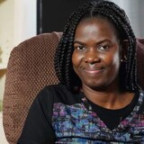Kate Onakpo, who crossed at Roxham Road in 2017, now works as a caregiver in Montreal. (Charles Contant/CBC)