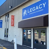 A building with a banner saying "Legacy Christian Academy".