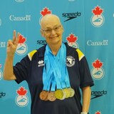Not letting cancer stop her, Lina Courtois competed at the Canadian Masters Swimming Championships and Canadian Artistic Swimming Championships in Calgary. She took home three gold medals. (Submitted by Lina Courtois.)