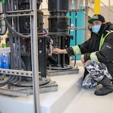 Marcus Moonias, one of three local water operators from Neskantaga First Nation, an Ojibwe community 436 kilometres northeast of Thunder Bay, Ont., is shown inspecting the community's upgraded drinking water plant in 2023. Many Indigenous communities in Canada do not have reliable access to drinking water.