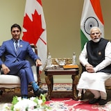 Prime Minister Justin Trudeau, left, walks past Indian Prime Minister Narendra Modi as they take part in a wreath-laying ceremony during the G20 Summit in New Delhi in September.