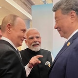 Russian President Vladimir Putin, from left, Indian Prime Minister Narendra Modi and Chinese President Xi Jinping talk ahead of the Shanghai Cooperation Organization (SCO) summit at the Meijiang Convention and Exhibition Center in Tianjin, China, Monday, Sept. 1, 2025. (Indian Prime Minister's Office via AP)
