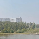 A building shown in smoky air. 