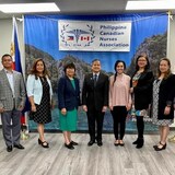 Mga miyembro ng Philippine Canadian Nurses Association nakatayo.