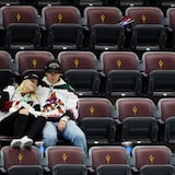 Arizona Coyotes fans sit in their seats long after the team's last game on Wednesday. 
